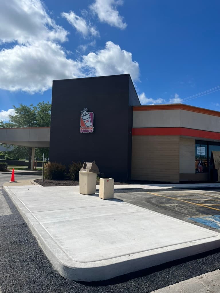Completed concrete pad and sidewalk at Dunkin' Donuts drive-through area