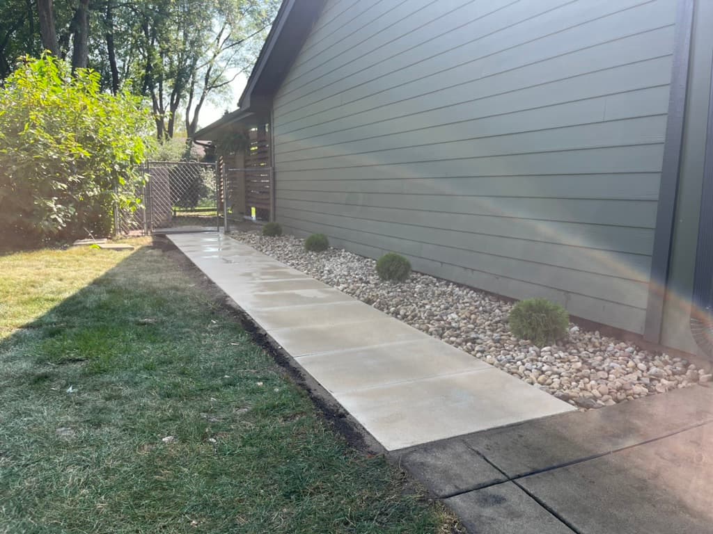 Large format concrete pavers creating accessible side yard pathway